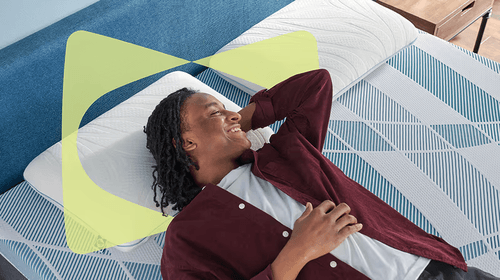 Man laying on Dreamlife mattress with Sealy Butterfly