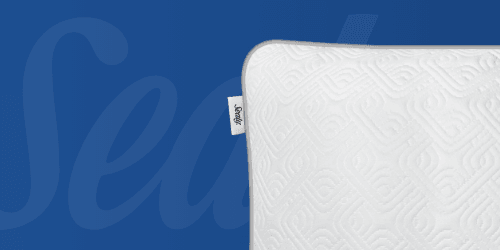 A corner view of a Sealy adjustable pillow with a blue Sealy background