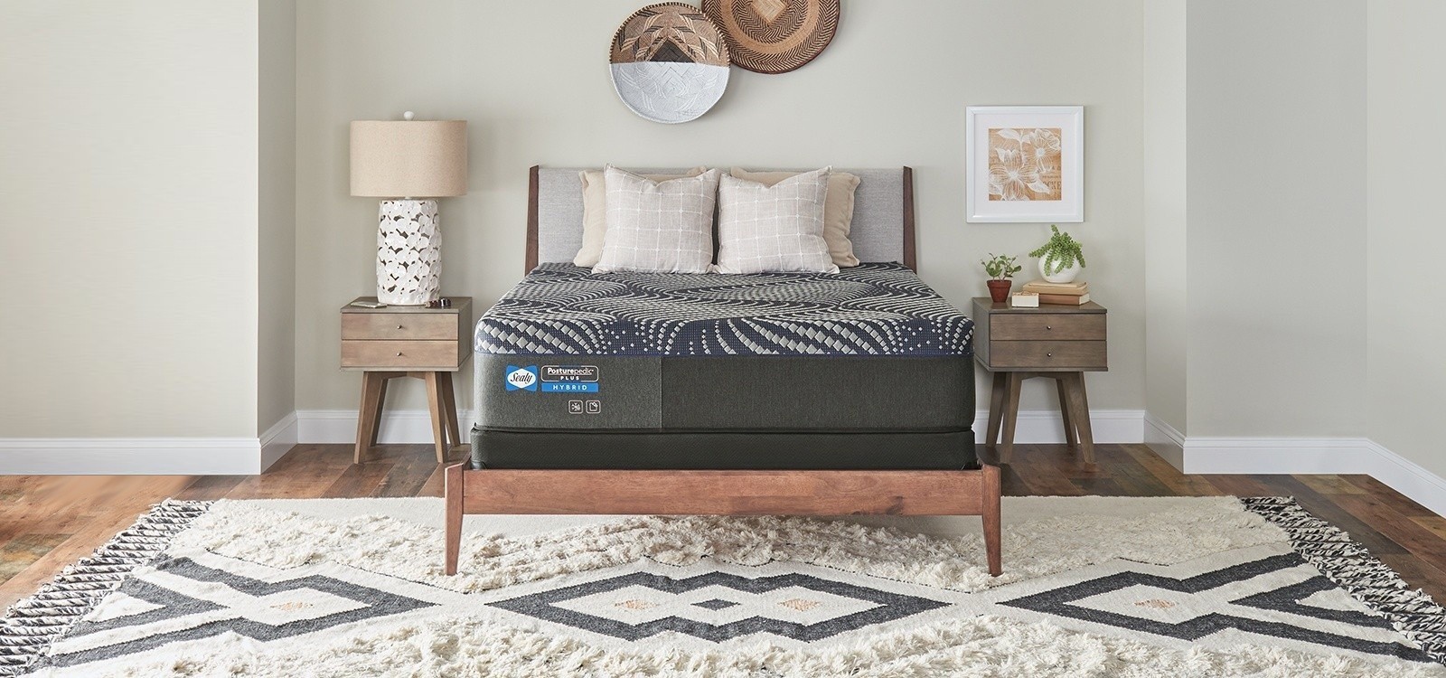 A posturepedic plus mattress in a styled room