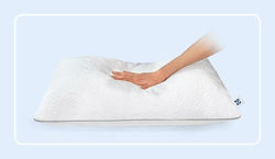 A hand pressing on a Sealy adjustable pillow with a rounded white border