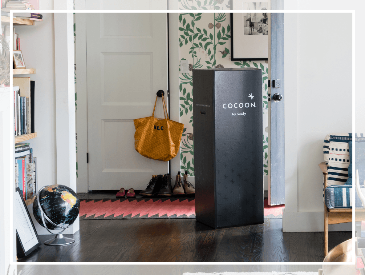 A cocoon mattress delivered in a box to the front door